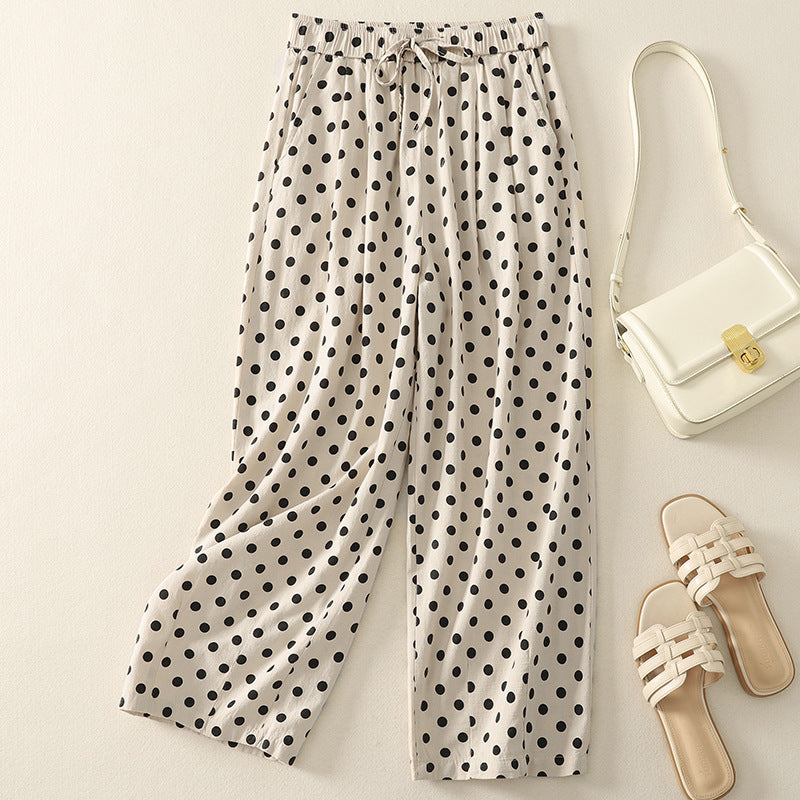 Stylish women's wide-leg polka dot pants, comfortable and flowy, showcasing a casual fashion look; side view