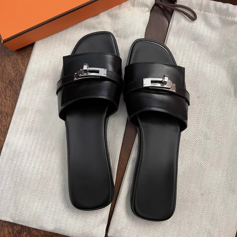 Stylish women's leather slip-on sandals featuring a modern square toe and decorative metallic buckle.
