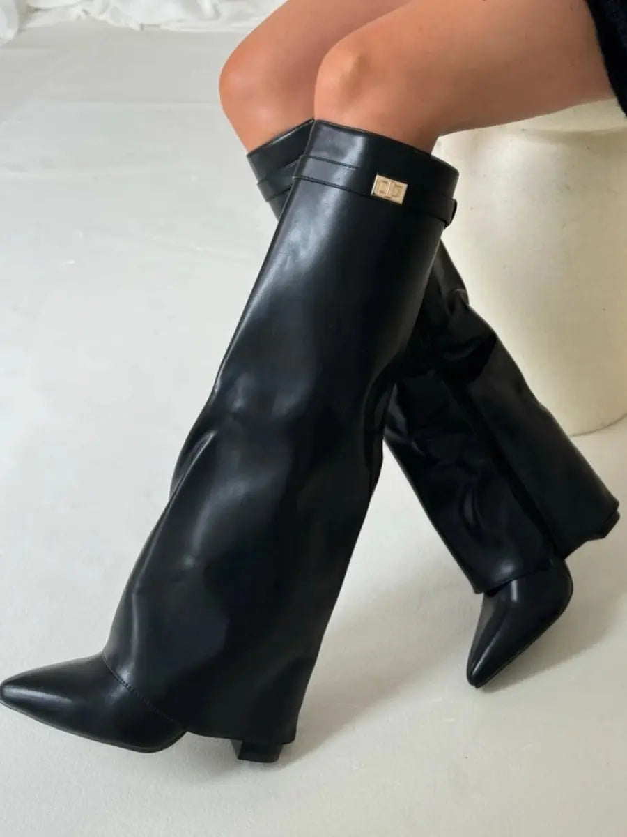 Elegant women's black boots: knee-high, pointed toe, and a sleek wedge heel, ideal for stylish outfits.