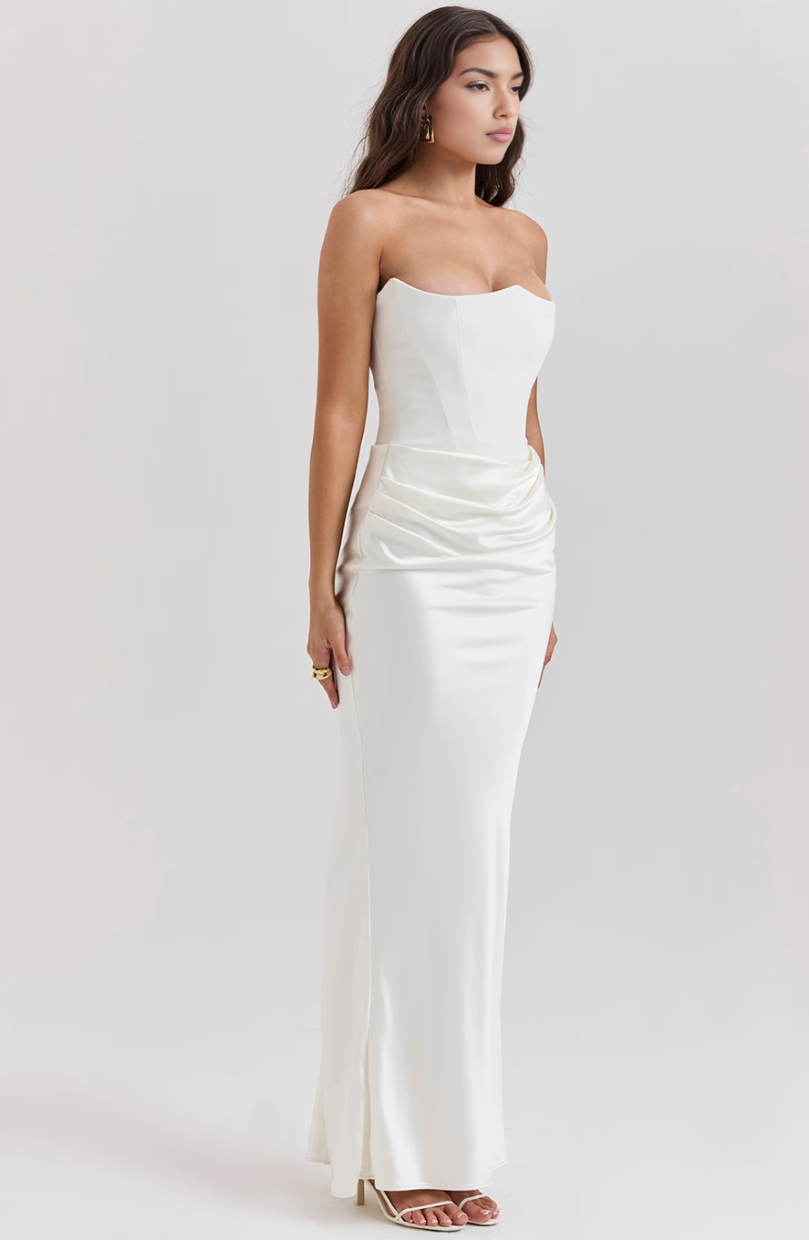 Fitted strapless homecoming dress, elegant draped design.