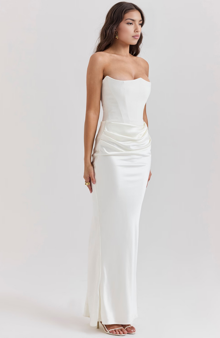 Fitted strapless homecoming dress, elegant draped design.