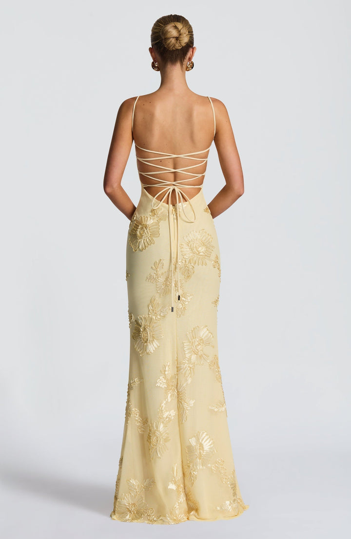 Elegant women's mermaid dress with beautiful floral appliqué, a corset design & long flowing skirt.