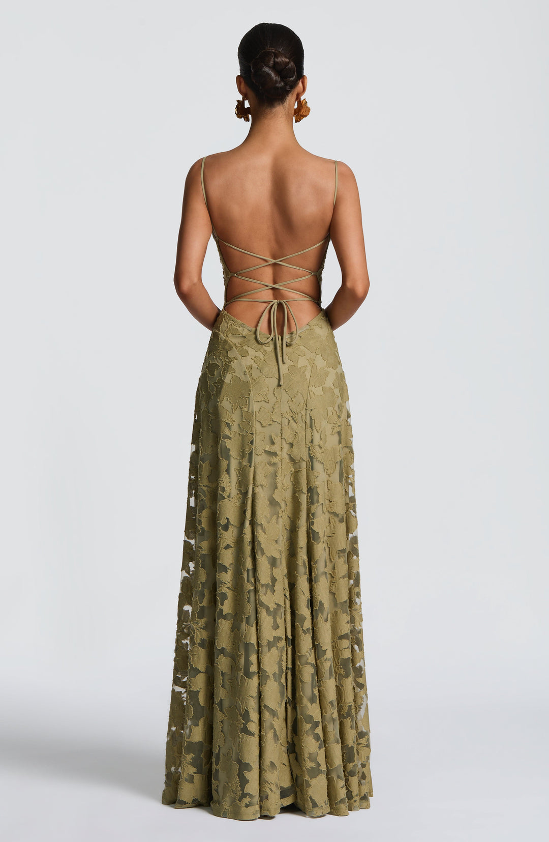 Sleeveless A-line floral maxi dress with stylish lace-up back and flattering waterfall neckline.