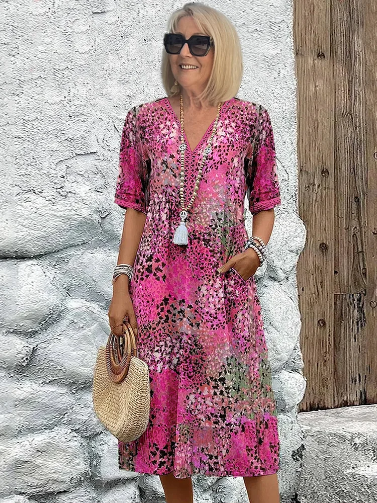 Flowing A-line women's floral midi dress with a flattering V-neck. Comfortable and chic for summer casual wear.