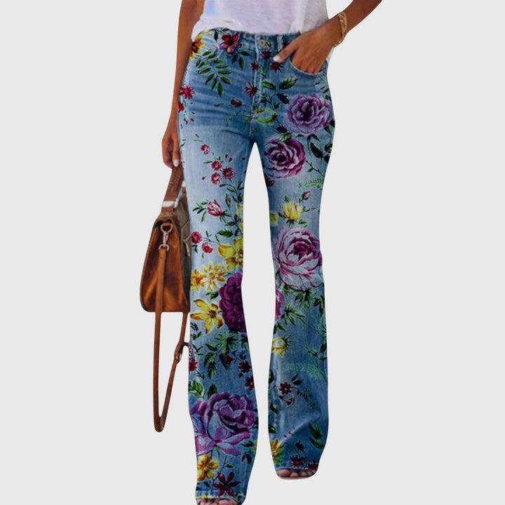 Elegant women's wide-leg pants with vibrant floral print and unique button detail. Perfect for a chic spring look.