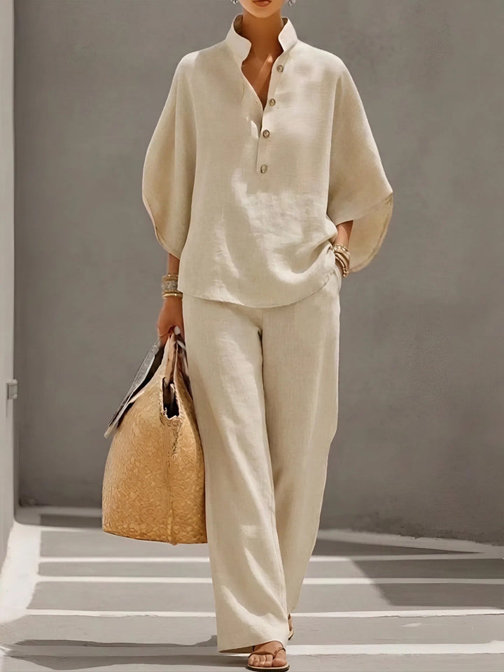 Side profile of a woman in a stylish mandarin collar wide-leg two-piece set, perfect for summer.