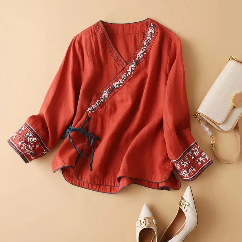 Comfortable women's patterned blouse with relaxed fit, elegant V-neck design. Perfect for casual.