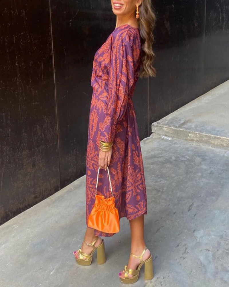 Flowing printed V-neck long sleeve maxi dress for women, comfortable & stylish wedding guest attire.
