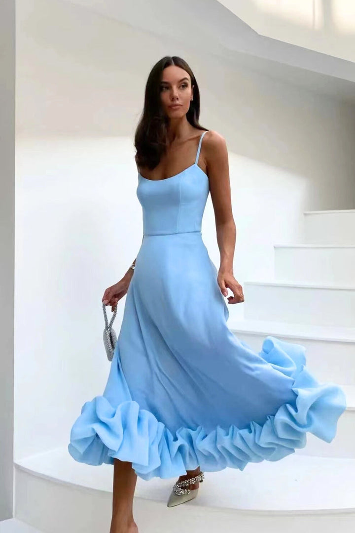 Stylish women's scoop-neck maxi dress, perfect for wedding guests, with delicate straps.