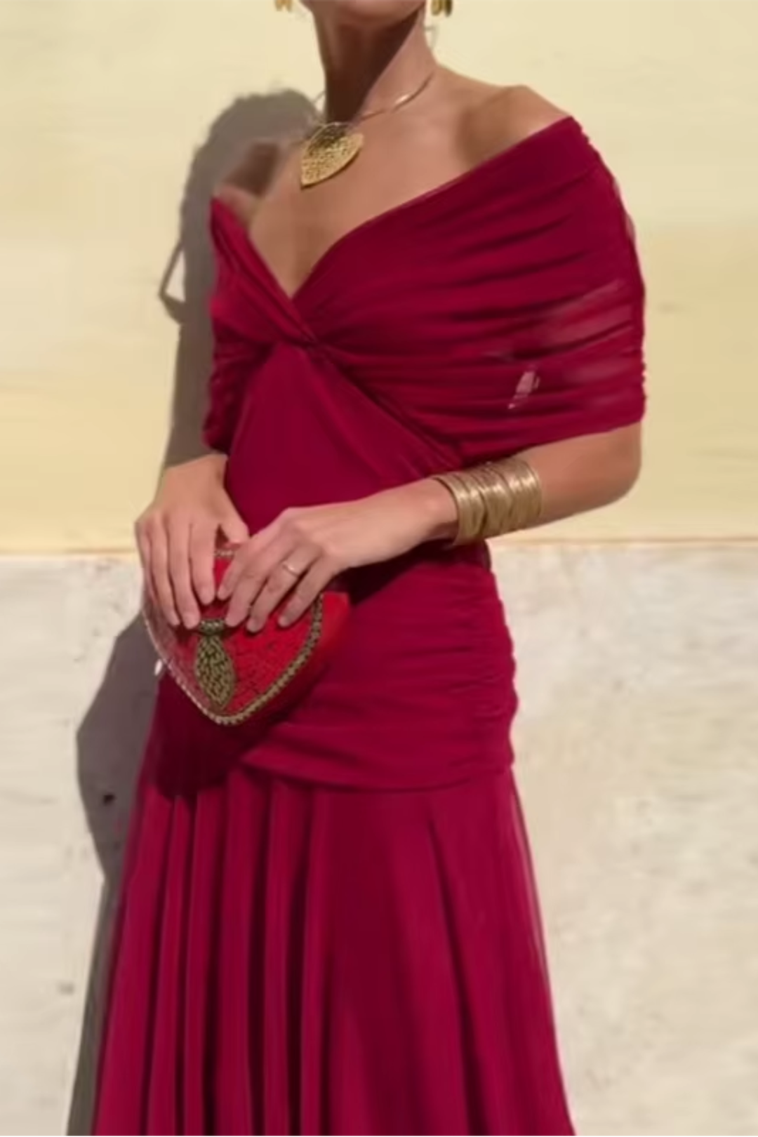 Women's elegant V-neck maxi dress with flutter sleeves. Flowy design and pleated waist for comfort.