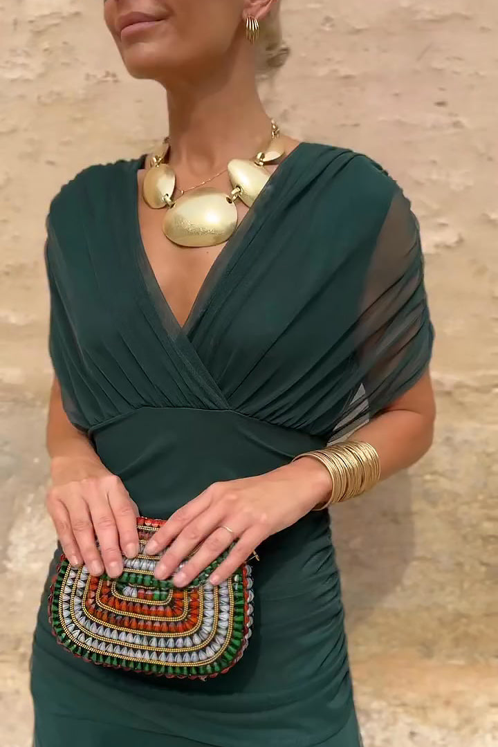 Stylish women's maxi dress featuring delicate flutter sleeves, a flattering V-neck, and elegant pleated waist.