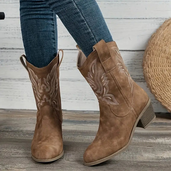 Women's embroidered Western boots with block heel, intricate stitching, and pointed toe, perfect for casual fashion.