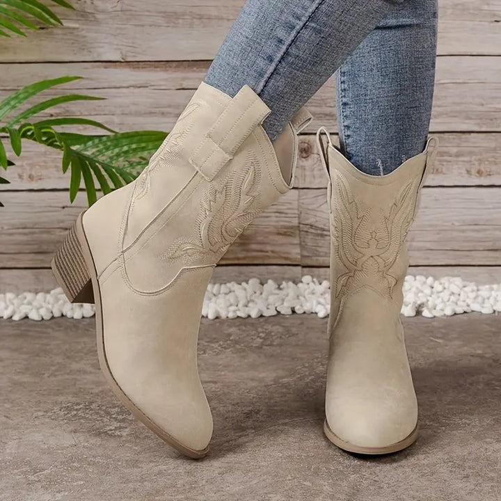 Fashionable women's cowboy boots featuring detailed embroidery, a comfortable block heel, and classic Western style.