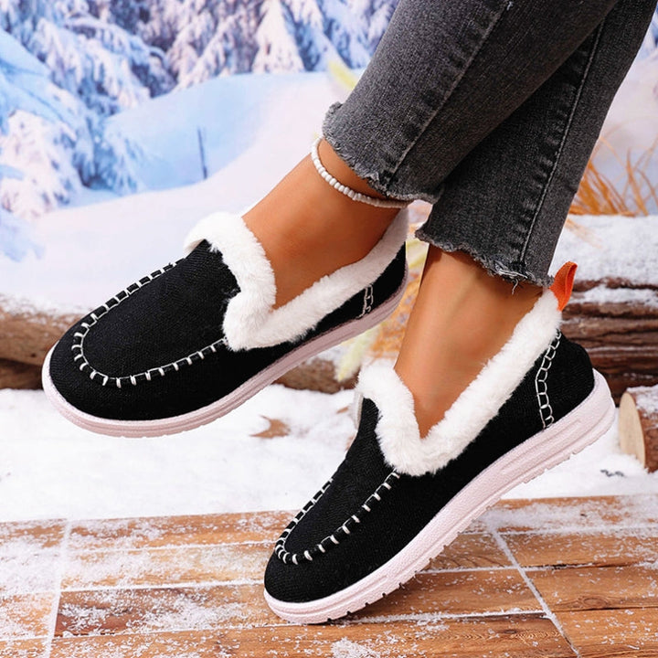 Detail of the soft faux suede texture and plush fur lining on women's slip-on comfort loafers