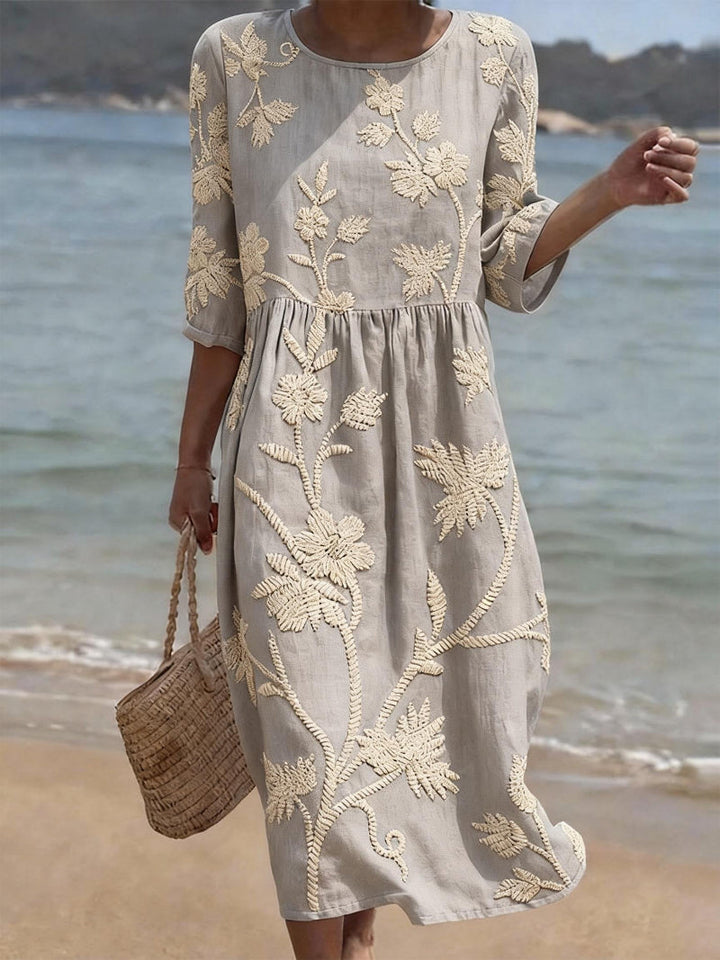 Beautiful women's floral maxi dress with a flowing silhouette, round neck, & three-quarter sleeves. Spring/summer style.