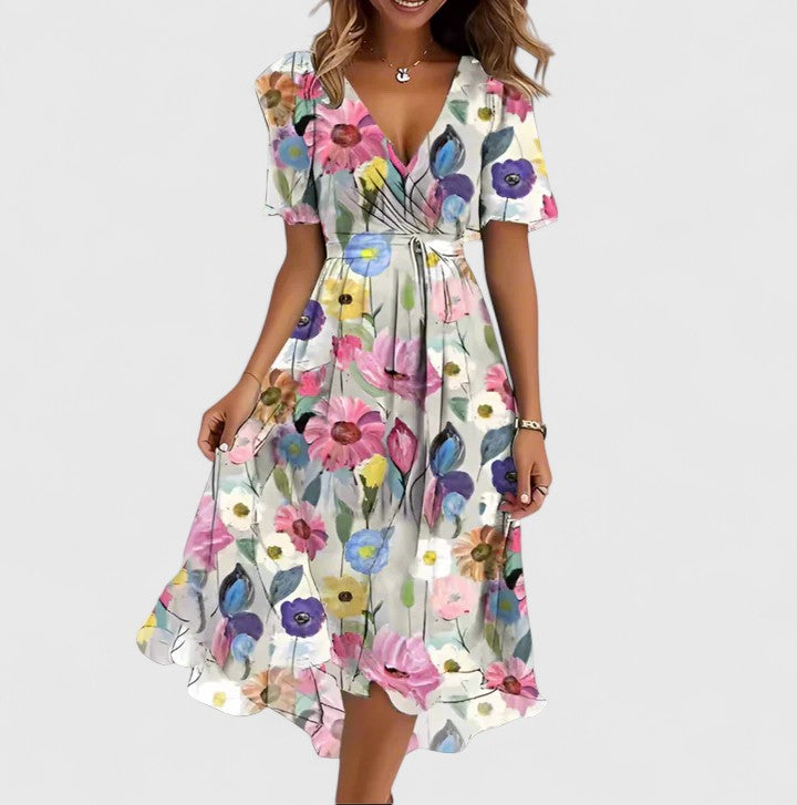 Flowy women's floral midi dress with flutter sleeves & V-neck, a comfortable & stylish choice for summer.