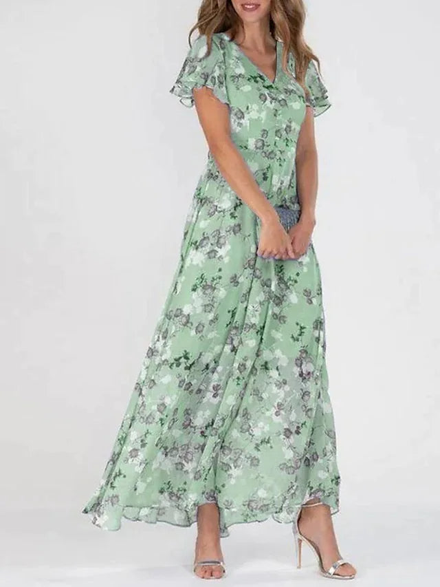 Comfortable women's summer floral maxi dress with flutter sleeves, ideal for casual or party wear.