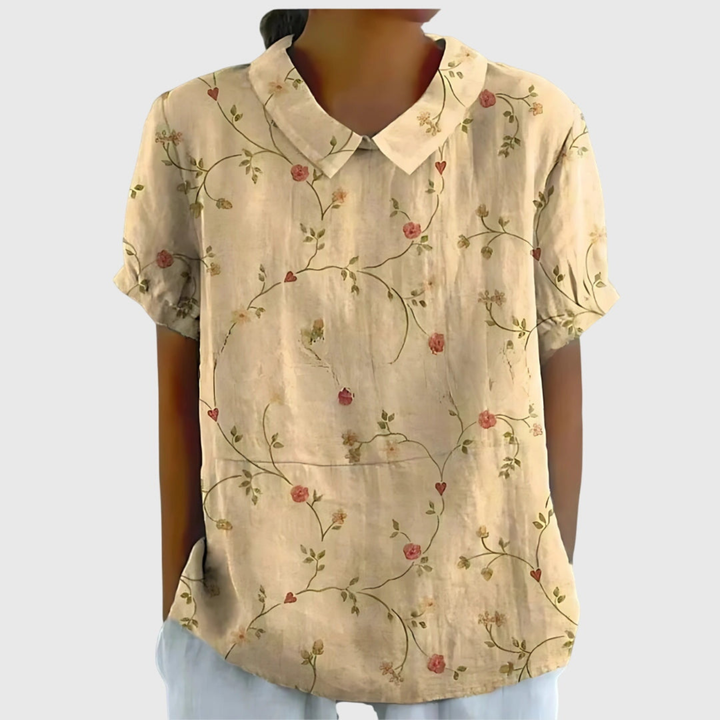 A versatile women's short sleeve floral print blouse. Collared, relaxed fit, great for any occasion.