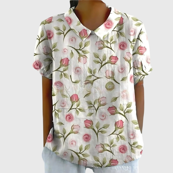 Relaxed fit women's floral print blouse. Comfortable short sleeve collared shirt for warm weather.