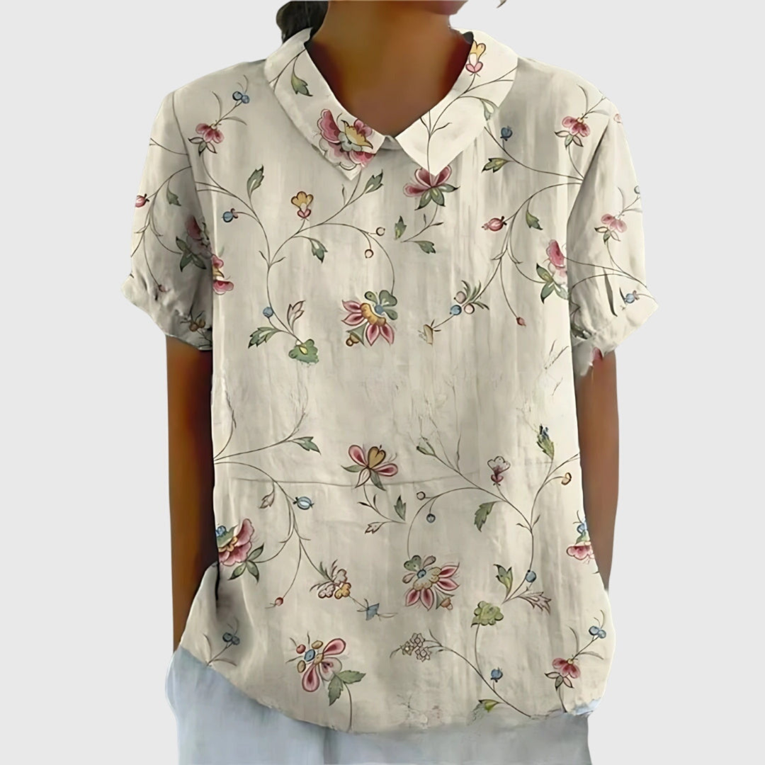 Versatile women's floral print blouse. Ideal for office wear or casual elegant summer style.