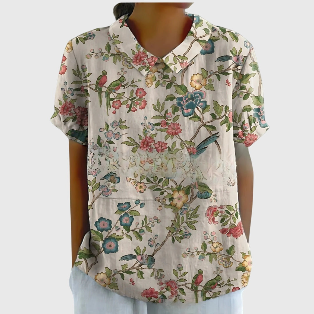 Stylish short sleeve floral print blouse for women. Collared top, relaxed fit, everyday fashion.