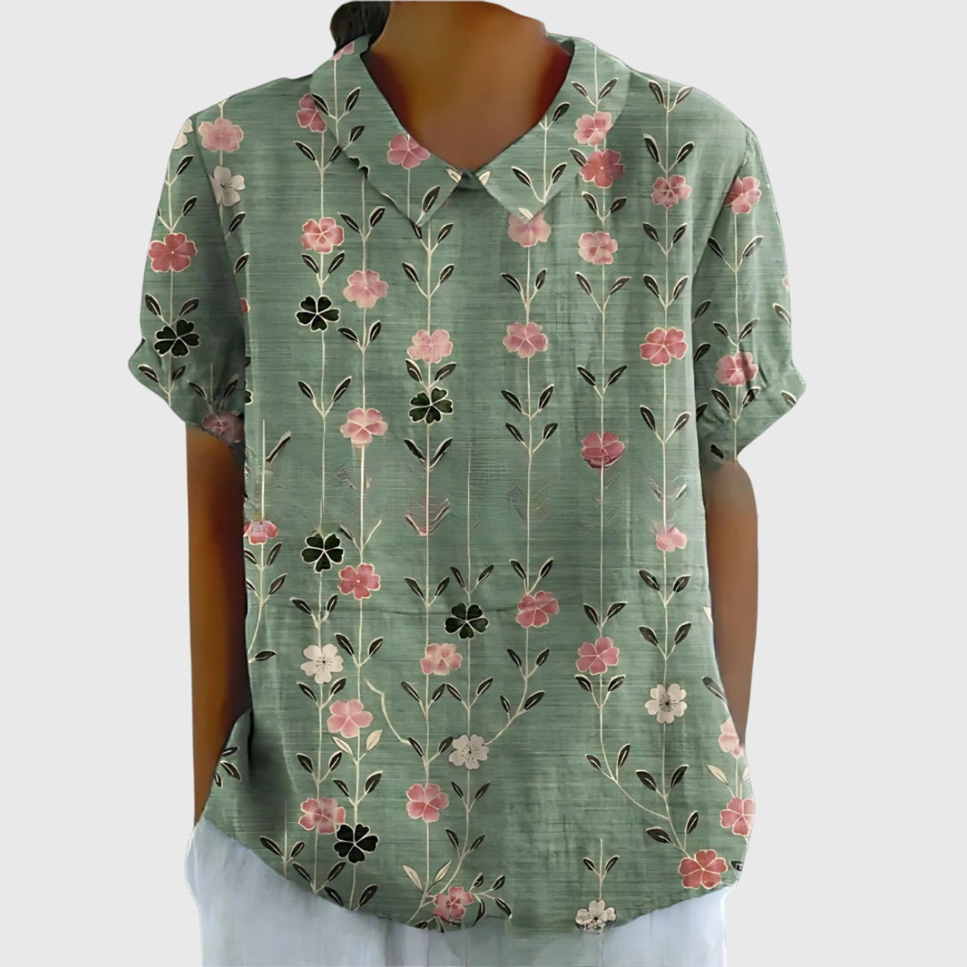 Summer fashion women's floral print blouse. Short sleeve, collared, relaxed fit for warm days.
