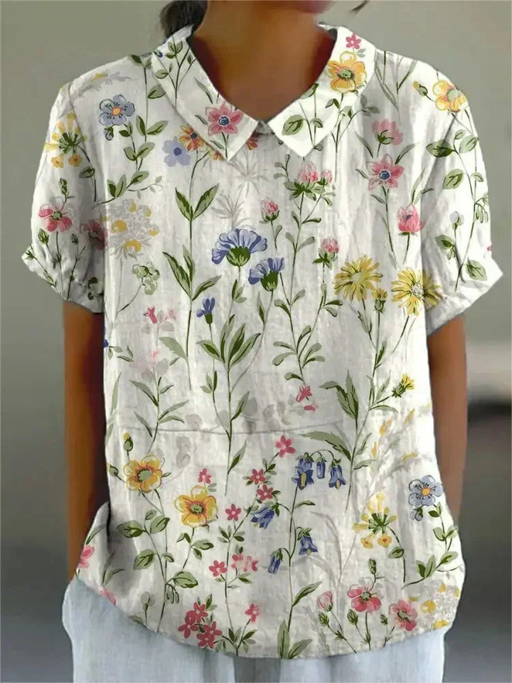 Stylish women's floral print short sleeve collared blouse. Versatile top for casual summer fashion & everyday wear.