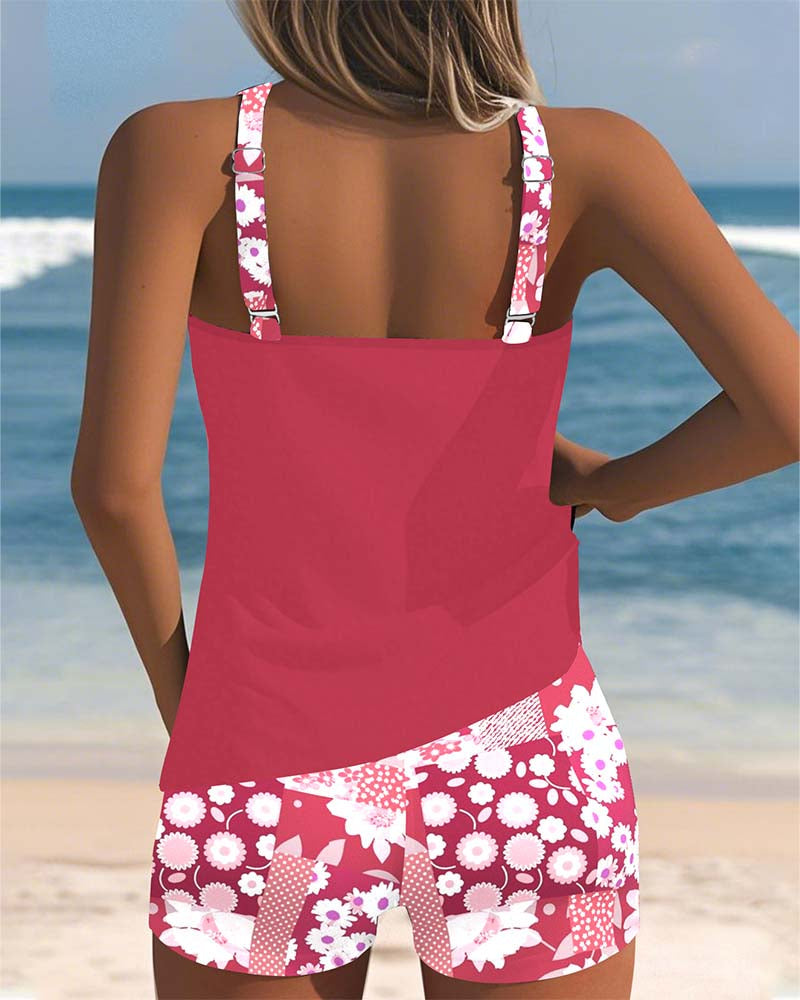 Close-up of women's floral print racerback tankini top. Vibrant pattern, supportive active swimwear.