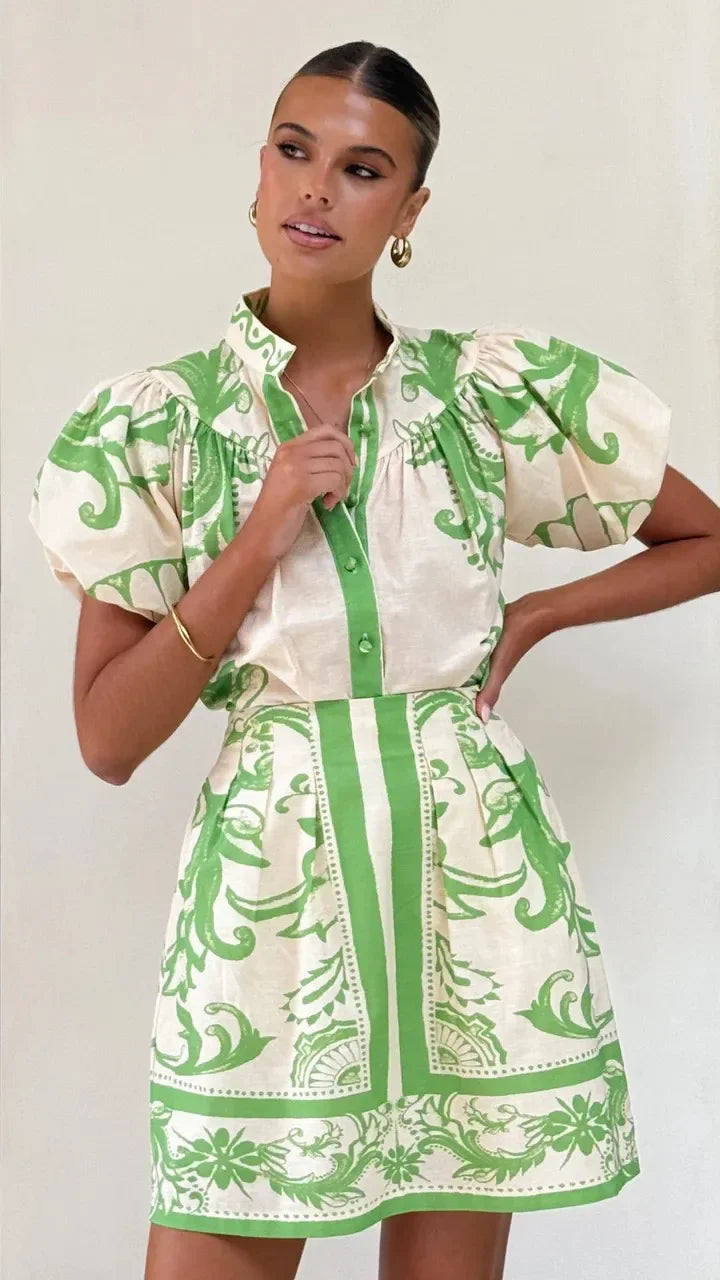 Elegant women's mini dress with floral print, puff sleeves. Perfect cocktail party attire.