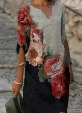 Detailed shot of the V-neck and fabric texture of the women's floral print midi dress.