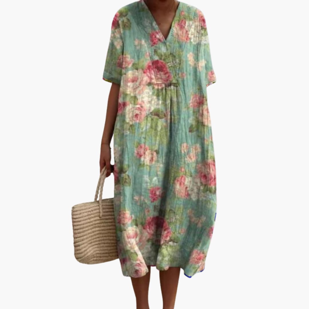 Women's short sleeve V-neck floral midi dress, designed for comfort and everyday wear. Oversized, with pockets.