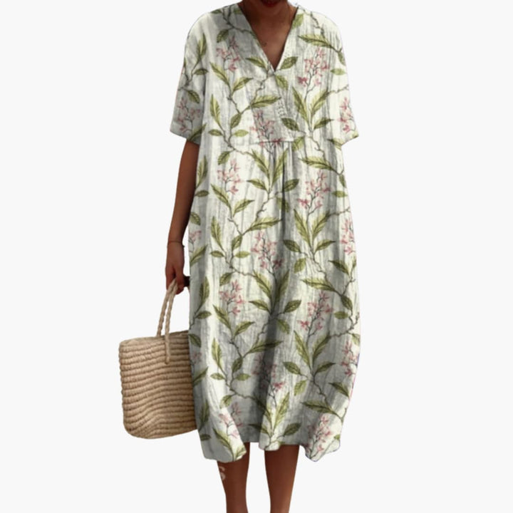 Front view of a women's floral V-neck short sleeve oversized midi dress, ideal for casual summer days.