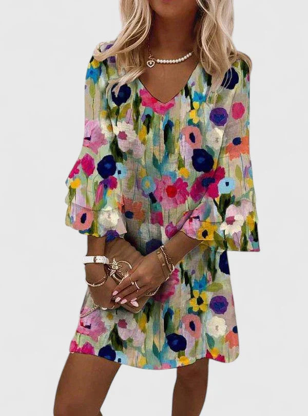Women's floral V-neck mini dress with ruffled sleeves, perfect for summer parties, beach days, or casual wear.