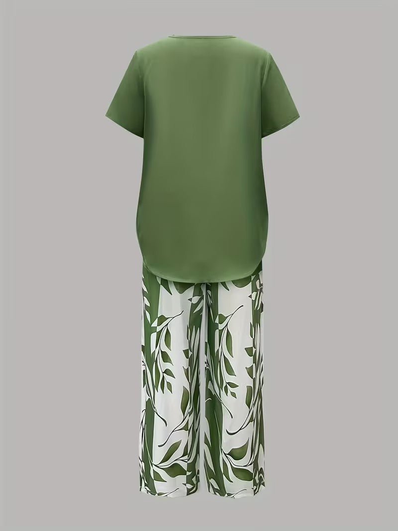 Women's wide-leg floral print pants with relaxed fit, paired with matching V-neck top. Comfortable casual set.