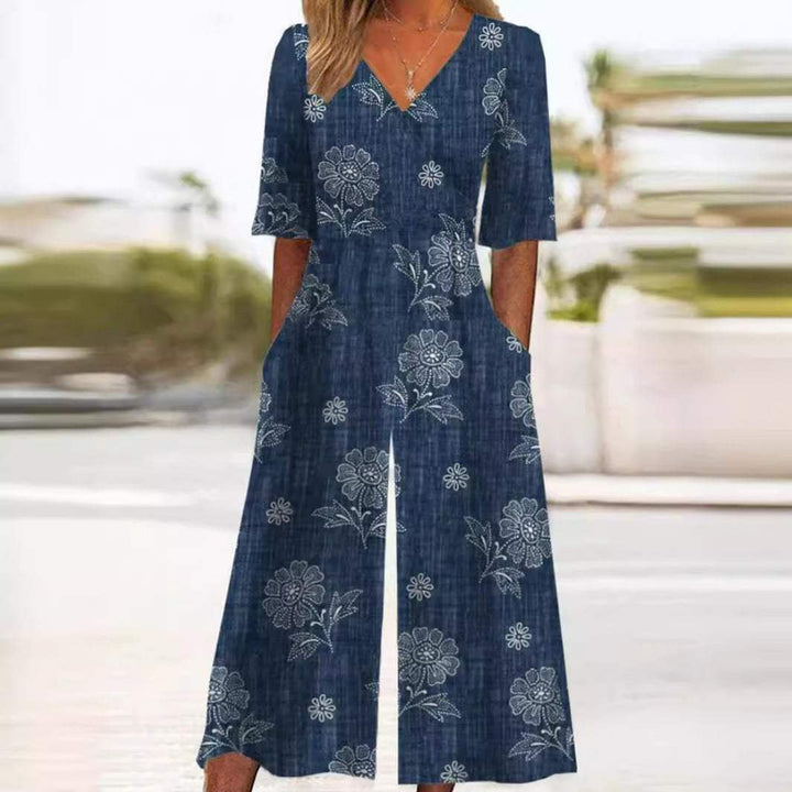 Women's floral wide leg jumpsuit with V-neck & elbow sleeves, perfect for bohemian style.