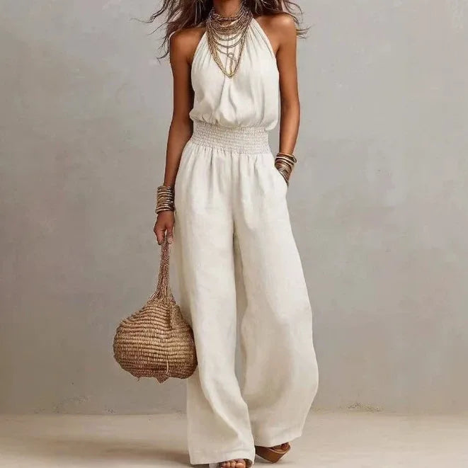 Stylish women's wide leg halter jumpsuit, a relaxed fit one-piece for effortless summer fashion & comfort.