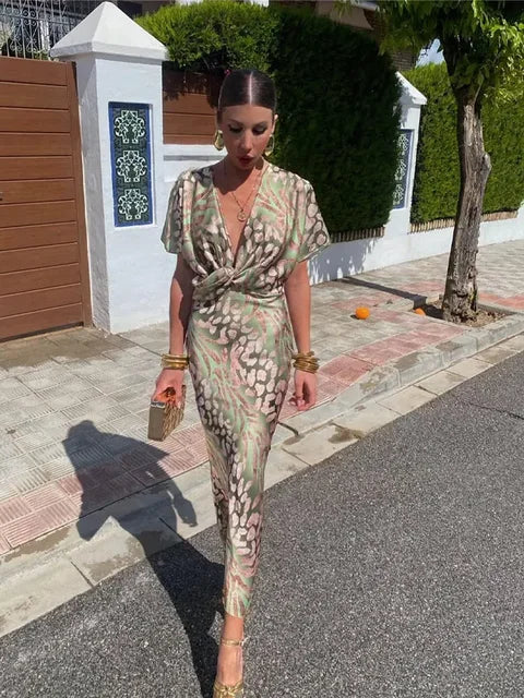 Gorgeous women's abstract print flowy midi wrap dress, featuring a unique pattern & comfortable silhouette.