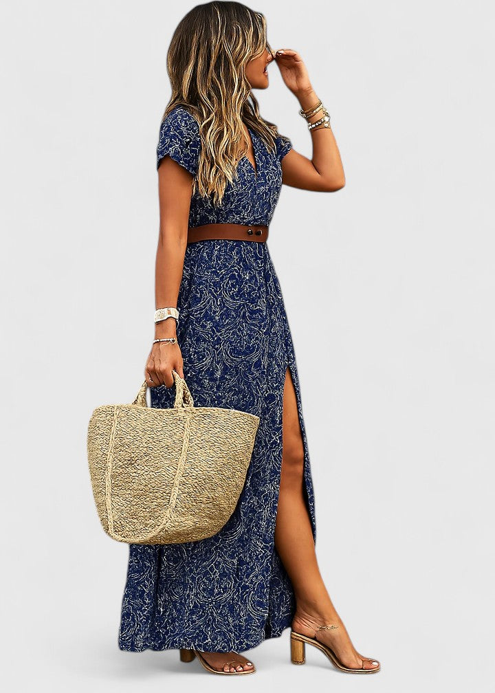 Women's flowy boho maxi dress. Elegant summer style with a vibrant print. Versatile day-to-night fashion.
