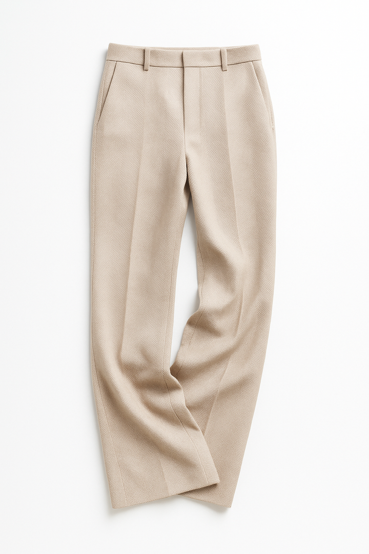 Close-up of straight leg hem of women's camel wool blend trousers, showing tailoring