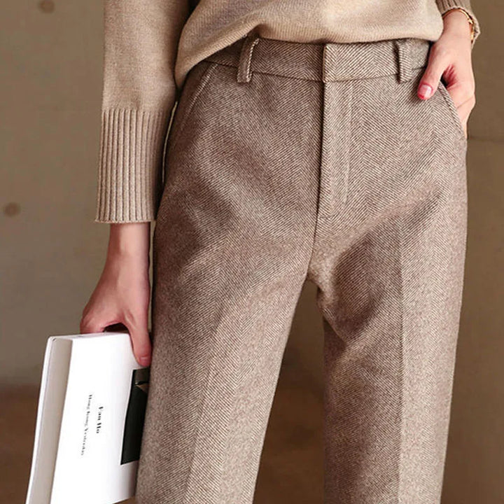Close-up of camel wool blend fabric texture on women's high-waist straight leg trousers