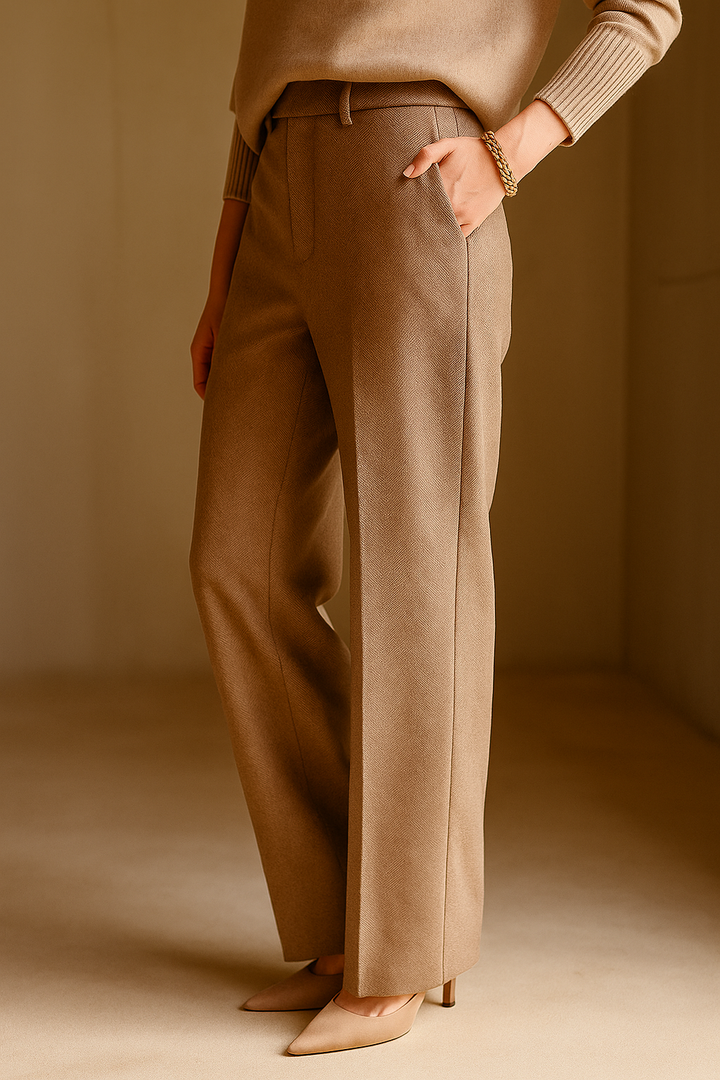 Detail of the high-waistband on women's camel wool blend straight leg trousers