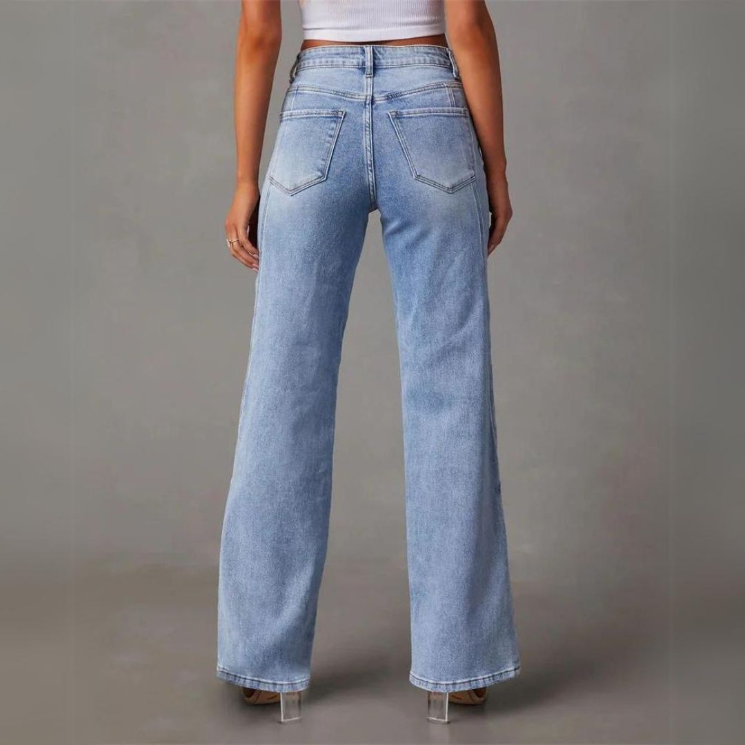 Full-length view of women's high-waist wide-leg blue denim jeans, showcasing their stylish and comfortable fit.