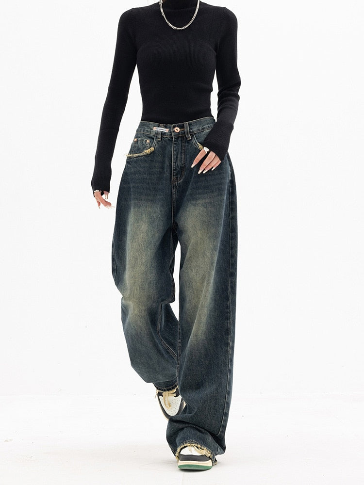Women's high-waisted, distressed, wide-leg denim jeans for a casual spring look