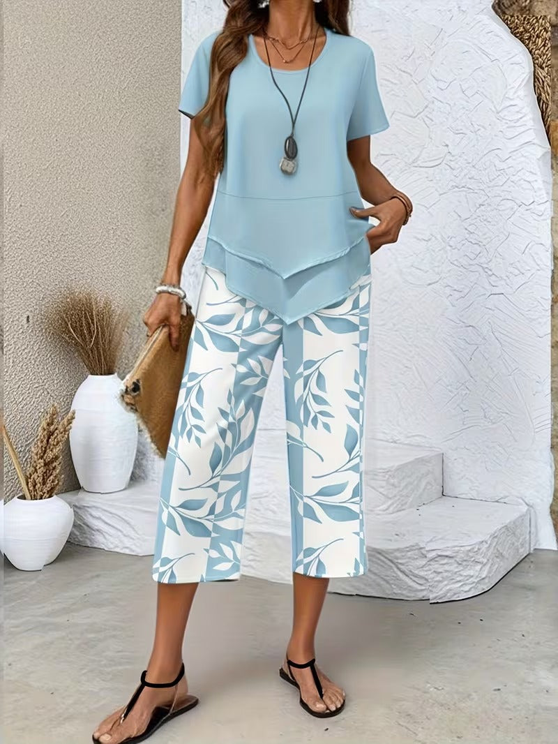 Short sleeve top & wide-leg pants set with botanical leaf print for women. Casual summer fashion, two-piece outfit.