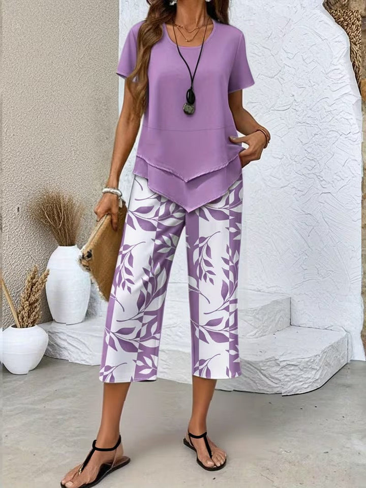 Summer fashion women's matching set. Botanical leaf print, short sleeve top & pants, ideal for elegant casual outfits.