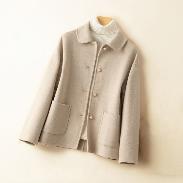 Comfortable women's button-up cashmere knit jacket, ideal for layering and sophisticated style