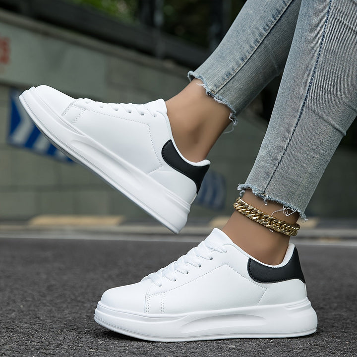 Side profile of women's orthopedic walking sneakers with arch support. Lightweight athletic footwear.