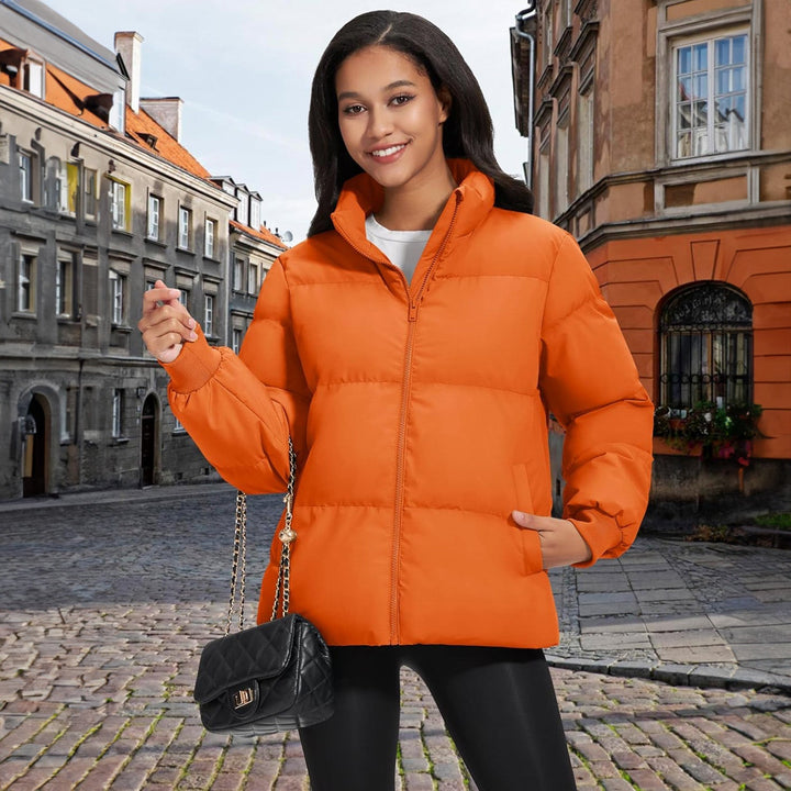 Woman on a winter hike, wearing a black lightweight quilted jacket, adventure ready