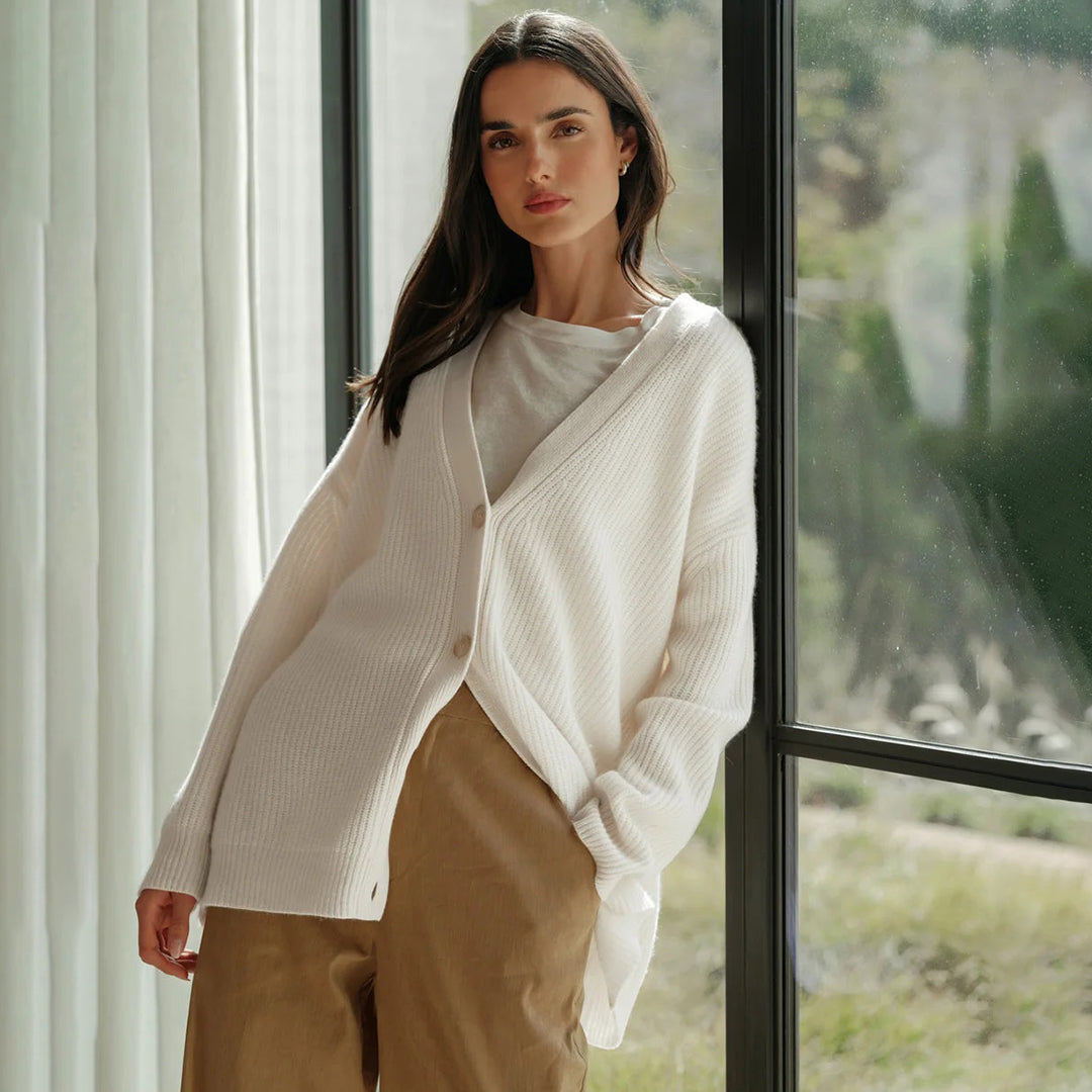 Elegant women's oversized cardigan, versatile for stylish layering & cozy comfort.