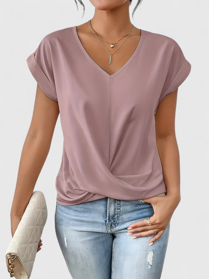 Comfortable women's Mahrianne top, designed with a trendy twist front and flattering V-neckline.